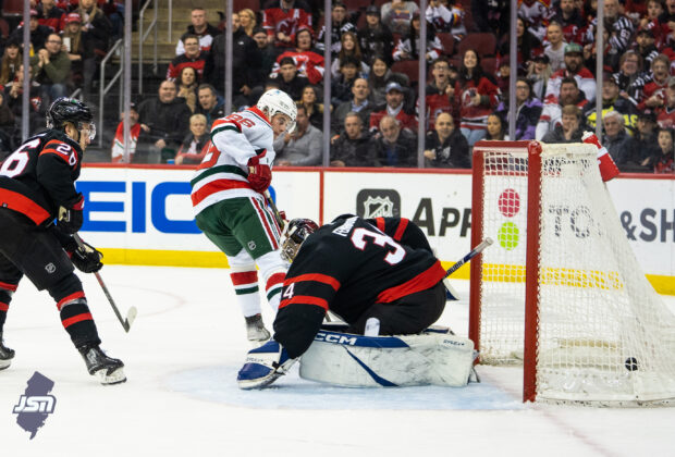 The New Jersey Devils score a goal against Ottawa in a NHL game.